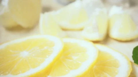 Lemon slices on the table and camera movement on the glass slow motion Stock Footage 87755862