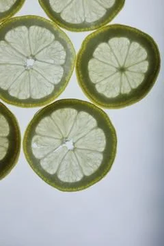 Lemon slices on white background Stock Photos