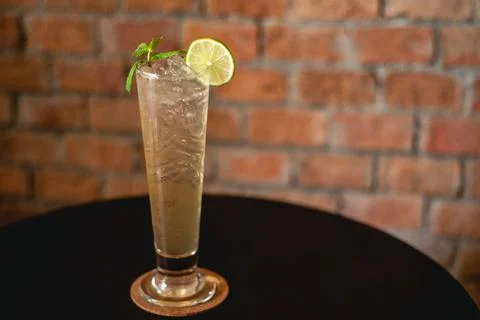 Lemon soda. Beverage for summer with brick wall background. Stock Photos