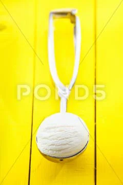 Lemon sorbet icecream in metal scoop Stock Photos