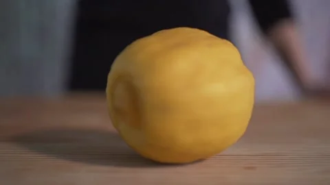 Lemon spinning rounds on tabletop Stock Footage 131048774