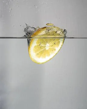 Lemon splash in water Stock Photos