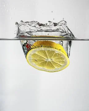 Lemon splash in water Stock Photos