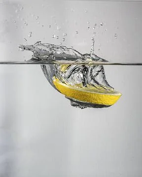 Lemon splash in water Stock Photos