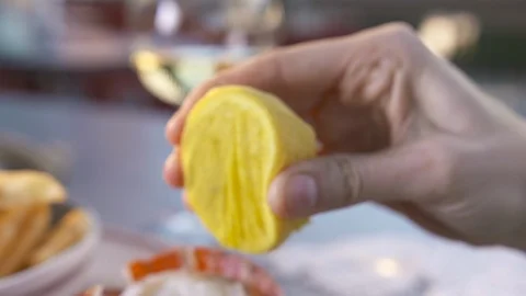Lemon squeeze over lobster tail  Stock Footage 112575640