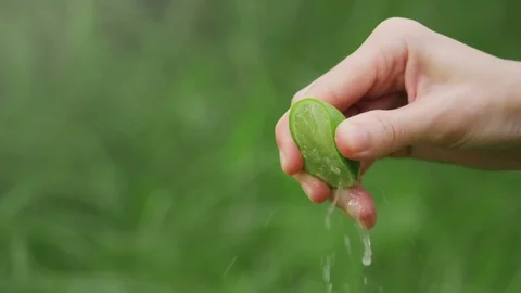 Lemon squeezed in slow motion Stock Footage 94756135