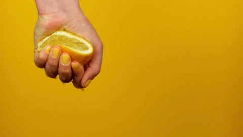 Lemon squeezer, close up. Person preparing to squeeze citrus juice from fruit Stock Footage 265839206