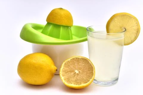 Lemon squeezer with lemon juice Stock Photos