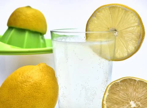 Lemon squeezer with lemon juice Stock Photos