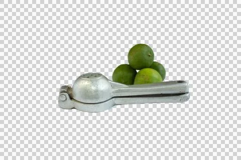 Lemon squeezer next to 4 green lemons Stock Photos