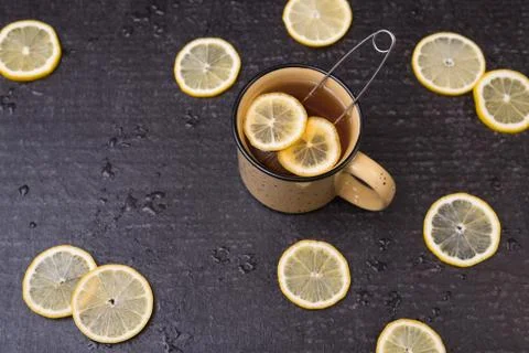 Lemon tea on a black background Stock Photos