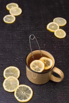 Lemon tea on a black background Stock Photos