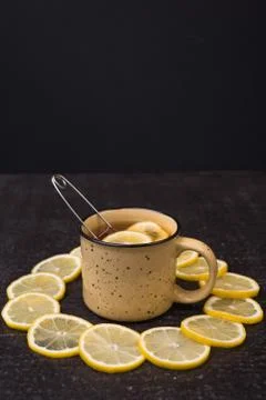 Lemon tea on a black background Stock Photos