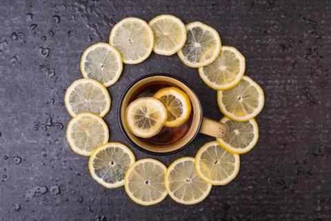 Lemon tea on a black background Stock Photos