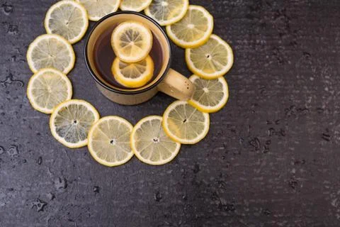Lemon tea on a black background Stock Photos