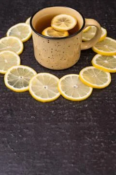 Lemon tea on a black background Stock Photos