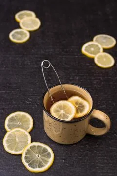 Lemon tea on a black background Stock Photos