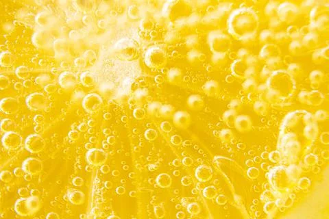 Lemon texture, macro. Abstract yellow summer background. Stock Photos