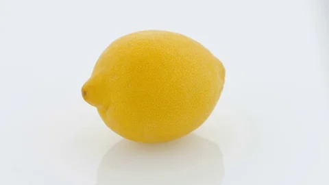 Lemon on Turntable - White Background Stock Footage 75854317