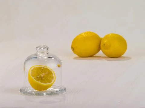 Lemon in ware on a table Stock Photos