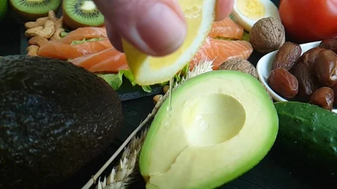 Lemon, water avocado red fish, spray Video stock 87126360