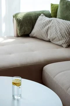Lemon water drink on table beside cozy couch 写真素材