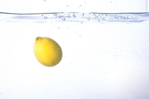 Lemon in water isolated Stock Photos