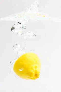 Lemon with water splash Stock Photos