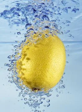 Lemon with water splash Stock Photos