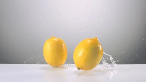 Lemon on water surface, Slow Motion Stock Footage 9302582