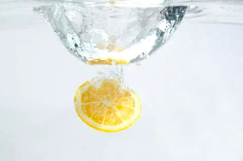 Lemon in the Water on White Background. Stock-Fotos