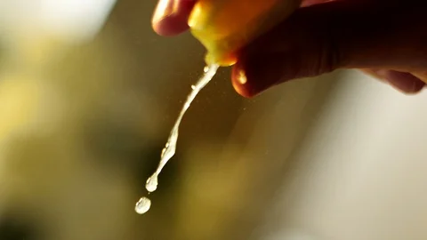 Lemon wedge squeeze  Stock Footage 120573104