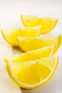 Lemon wedges Stock Photos