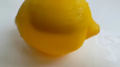 Lemon on a white background slow-motion shot Stock Footage 89815657