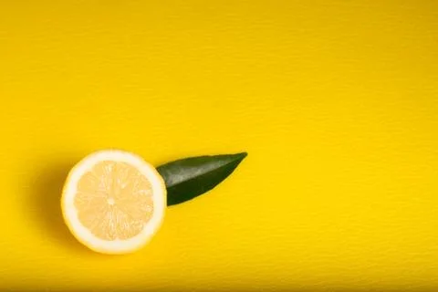Lemon on Yellow Background Stock Photos