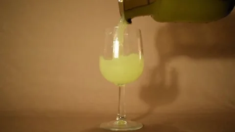 Lemon yellow colored liquid in vine glass Stock Footage 227518395