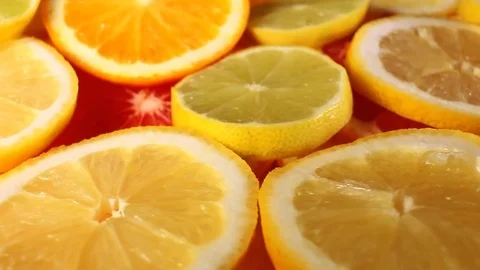 Lemon yellow lime slices rotating pattern macro texture background backdrop Stock Footage 91379445