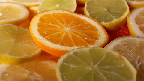 Lemon yellow lime slices rotating pattern macro texture background backdrop Stock Footage 91379453