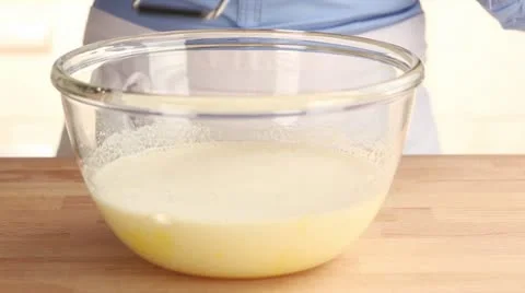 Lemon zest being grated into cake mixture Stock Footage 24657145