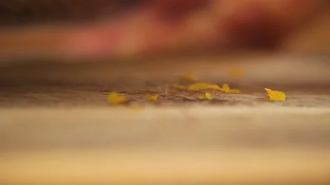 Lemon zest falling on the table Stock Footage 76198162