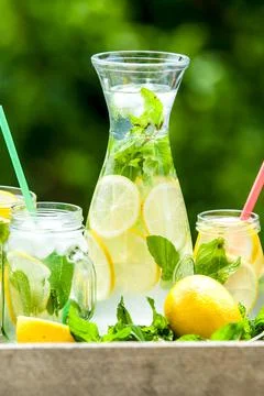 Lemonad jars with mint and ice Stock Photos