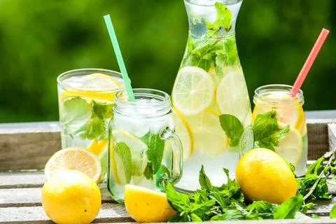 Lemonad jars with mint and ice Stock Photos