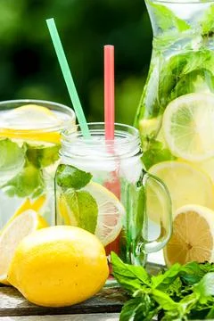 Lemonad jars with mint and ice Stock Photos