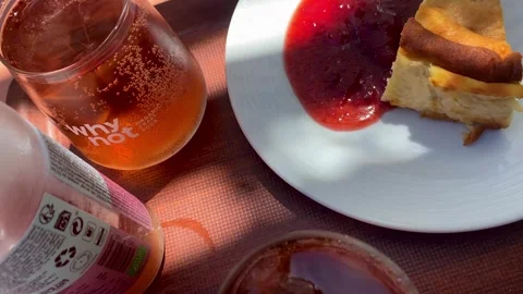 Lemonade and Cheesecake with Berry Jam on Cafe Table, Top View Stock Footage 343874216