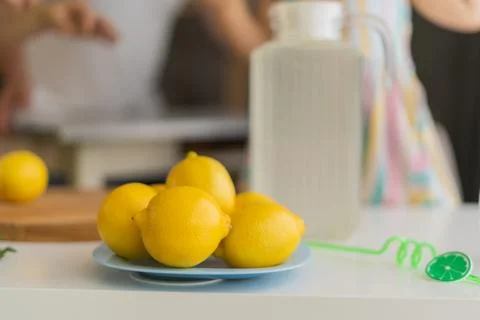 Lemonade on the background of a jug of lemonade Stock Photos