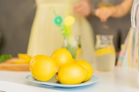 Lemonade on the background of a jug of lemonade Stock Photos