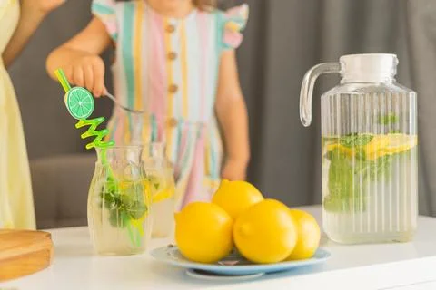 Lemonade on the background of a jug of lemonade Stock Photos