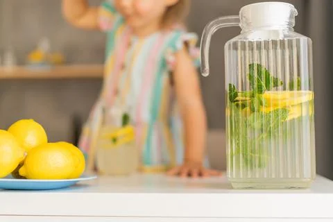 Lemonade on the background of a jug of lemonade Foto stock