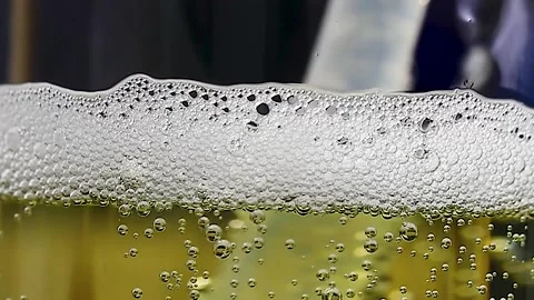 Lemonade bubbles in a glass glass, Stock Footage 258051985