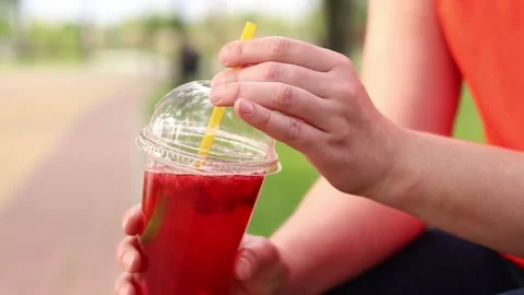 Lemonade in a disposable plastic cup, 4 00001184 Stock Footage 311109341